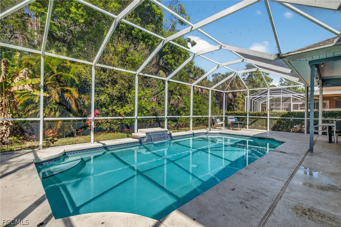 22866 Forest Ridge Drive Estero, FL 33928 - Photo 30 of 38 a view of a room with wooden floor and windows