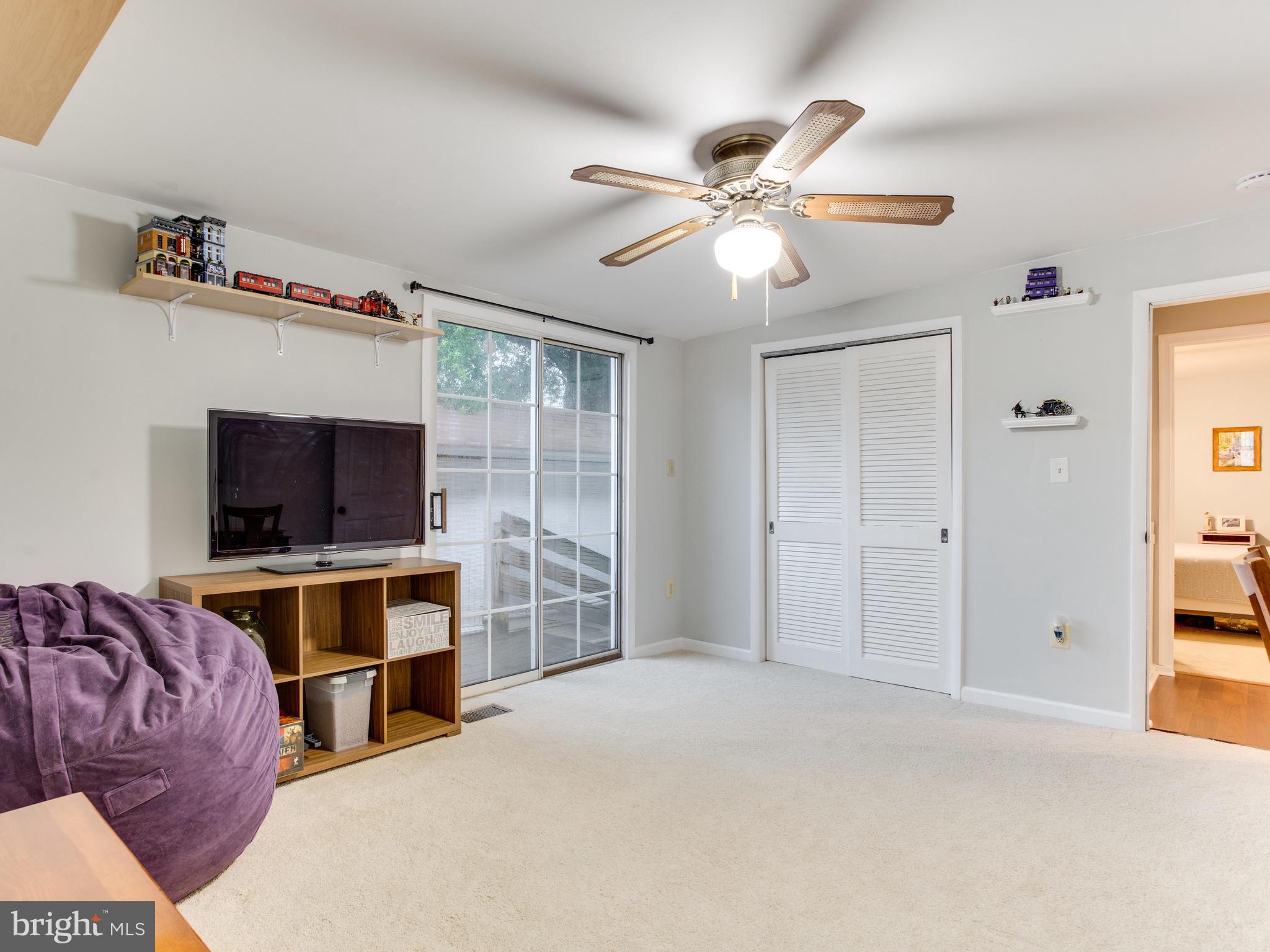 950 Mayo Road Edgewater, MD 21037 - Photo 20 of 46 Bright bedroom with sliding doors and large closet