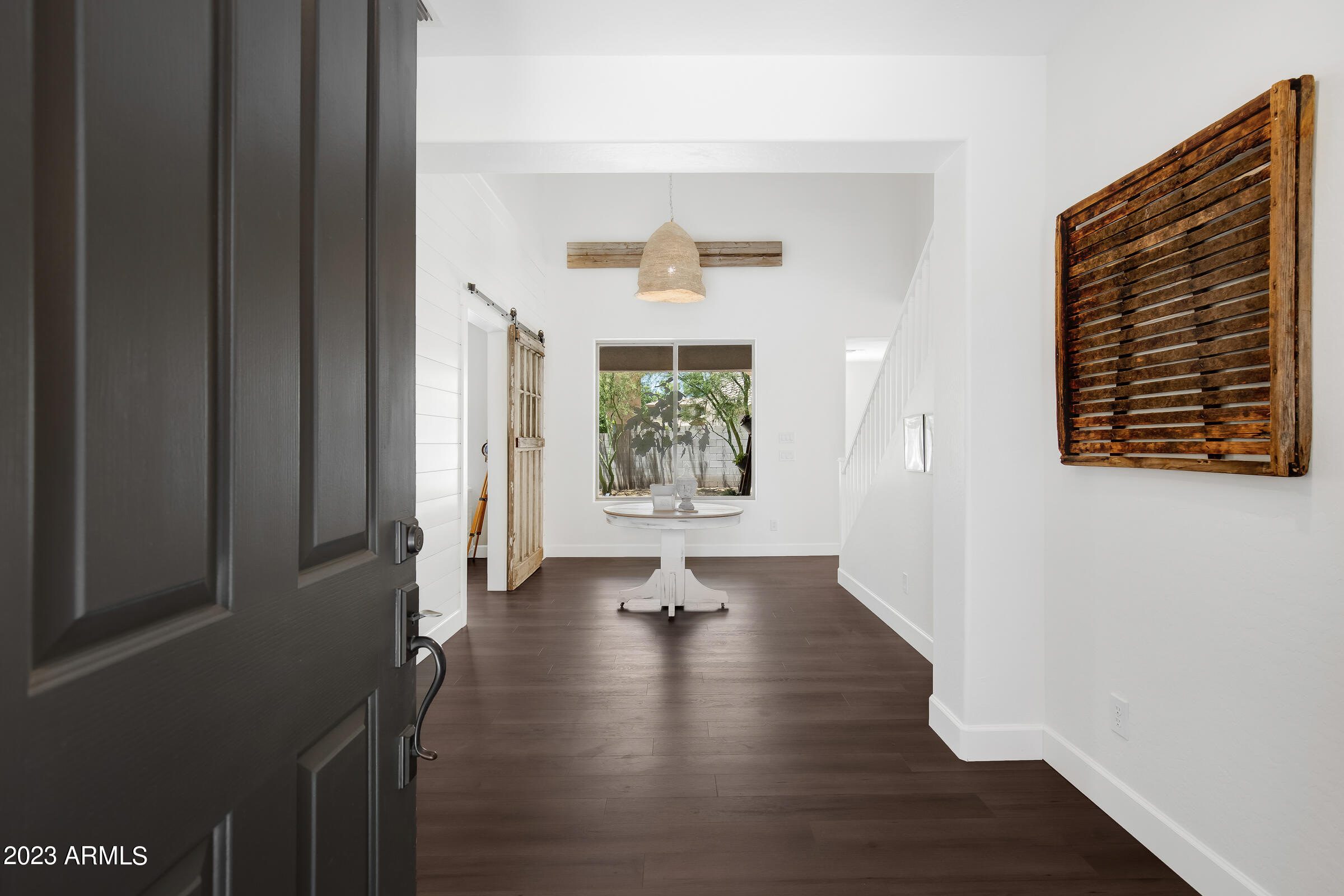 4736 East Timberline Road Gilbert, AZ 85297 - Photo 1 of 49 a view of an entryway with wooden floor