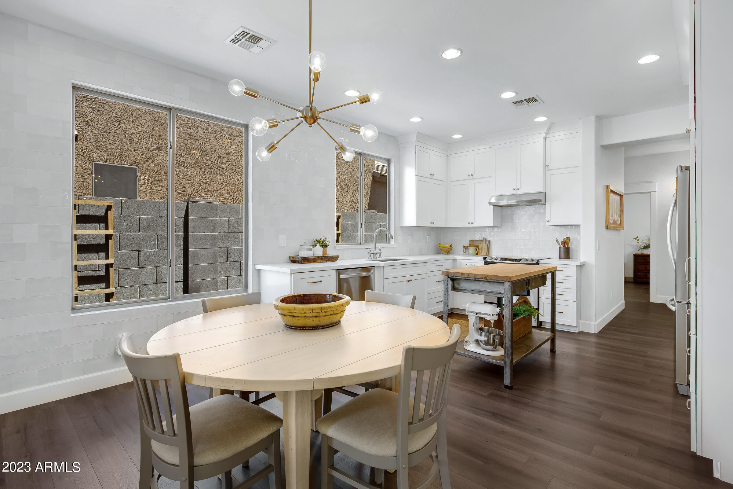 4736 East Timberline Road Gilbert, AZ 85297 - Photo 12 of 49 a view of a dining room with furniture and wooden floor