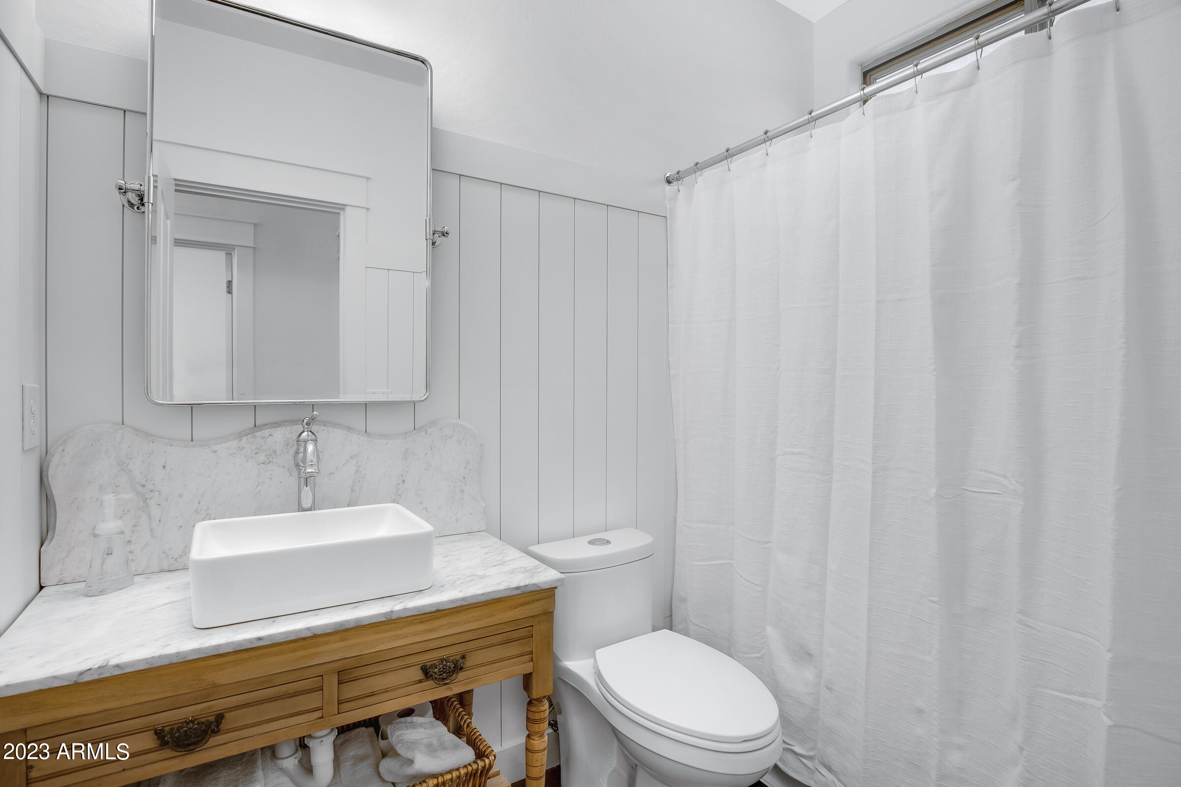 4736 East Timberline Road Gilbert, AZ 85297 - Photo 20 of 49 a bathroom with a sink a toilet and shower curtain