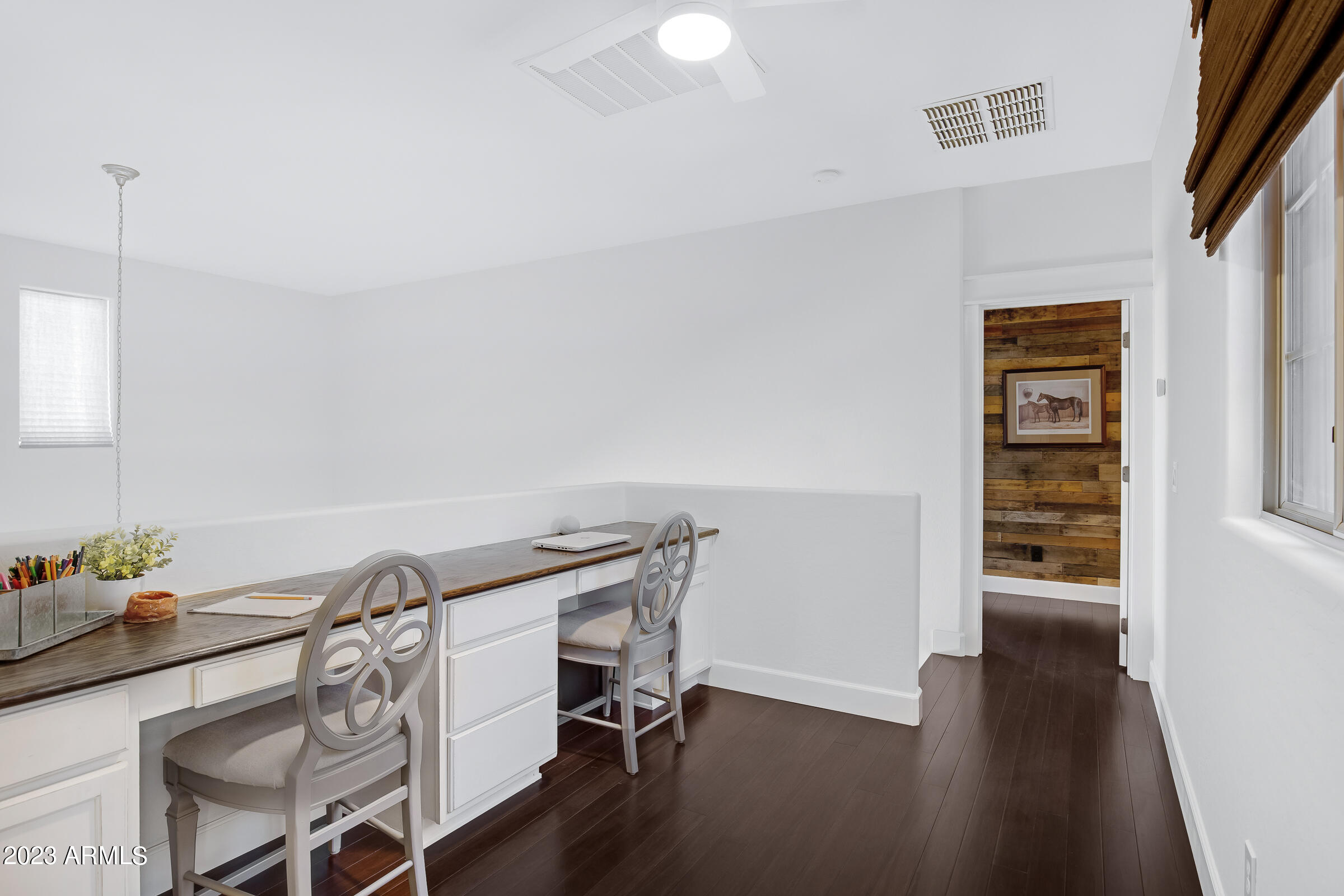 4736 East Timberline Road Gilbert, AZ 85297 - Photo 23 of 49 a view of a workspace with furniture and wooden floor
