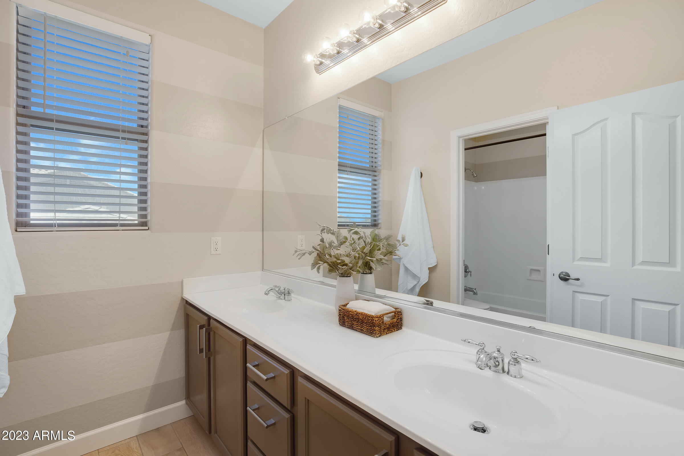 4736 East Timberline Road Gilbert, AZ 85297 - Photo 26 of 49 a bathroom with a sink and a mirror
