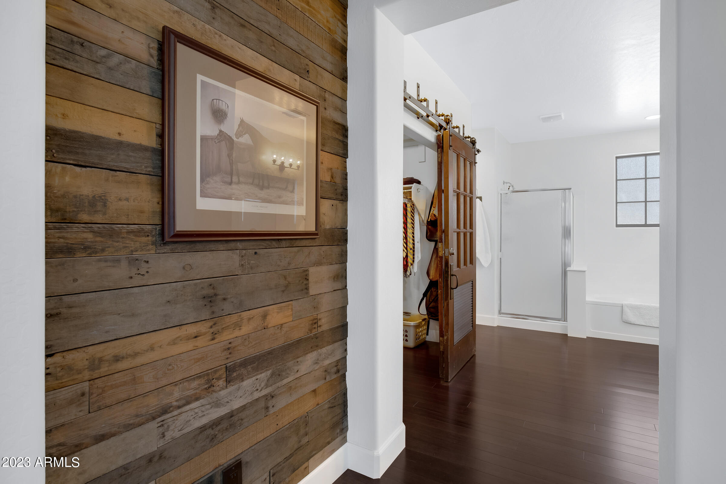 4736 East Timberline Road Gilbert, AZ 85297 - Photo 31 of 49 a view of a hallway with wooden floor and closet
