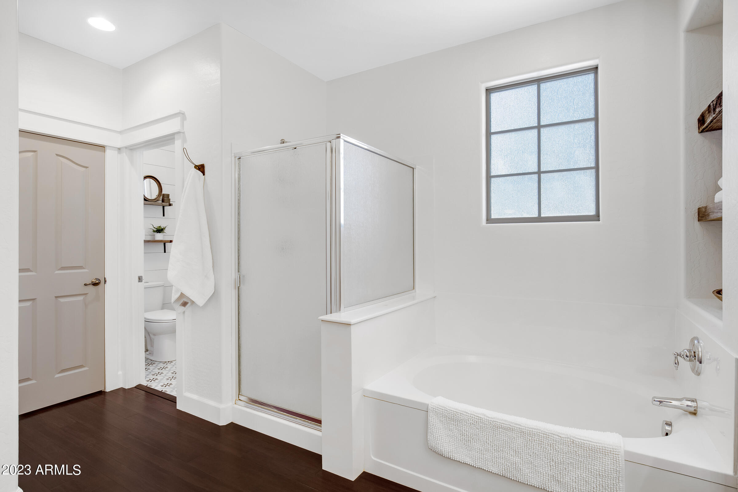 4736 East Timberline Road Gilbert, AZ 85297 - Photo 33 of 49 a bathroom with a bathtub and a shower