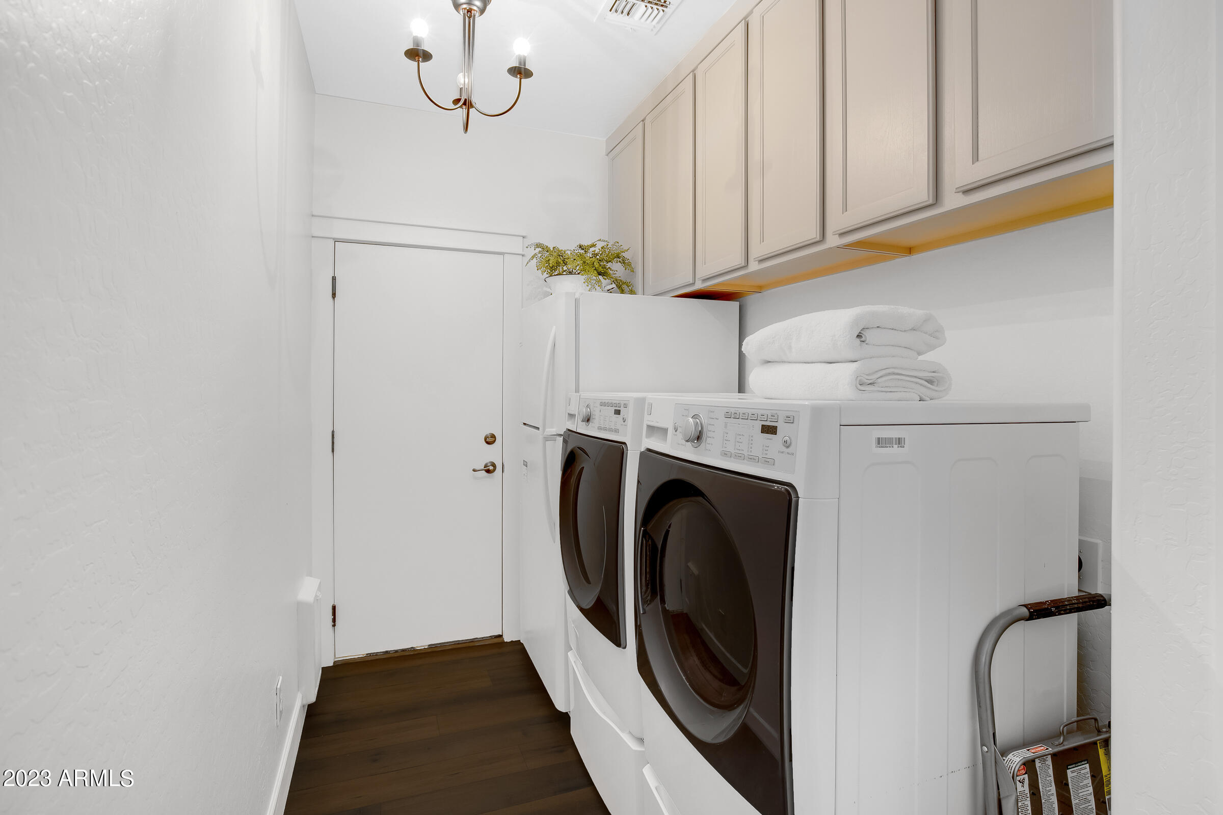 4736 East Timberline Road Gilbert, AZ 85297 - Photo 36 of 49 a view of a storage and utility room with washer and dryer