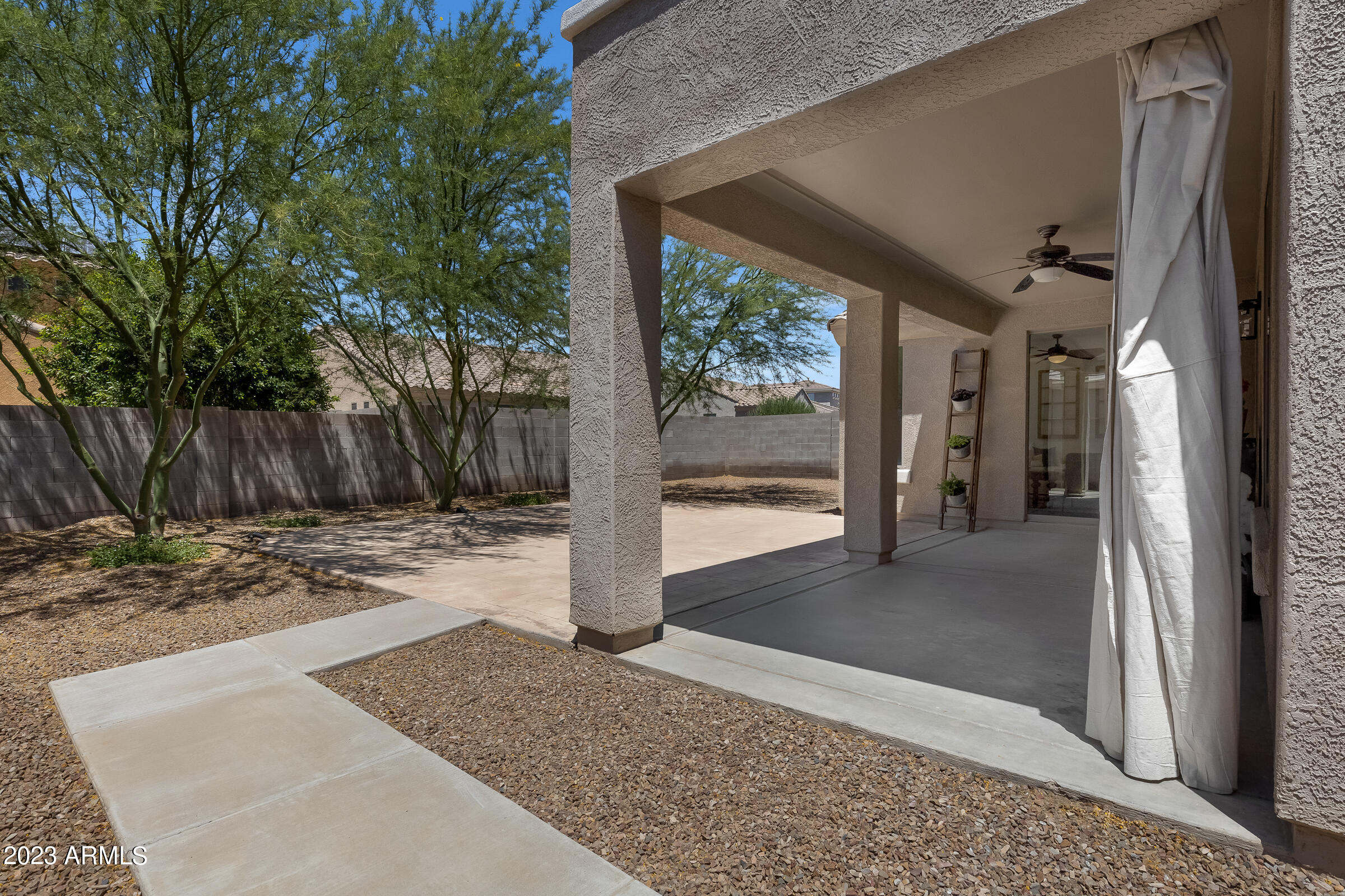 4736 East Timberline Road Gilbert, AZ 85297 - Photo 39 of 49 a view of a porch with a tree