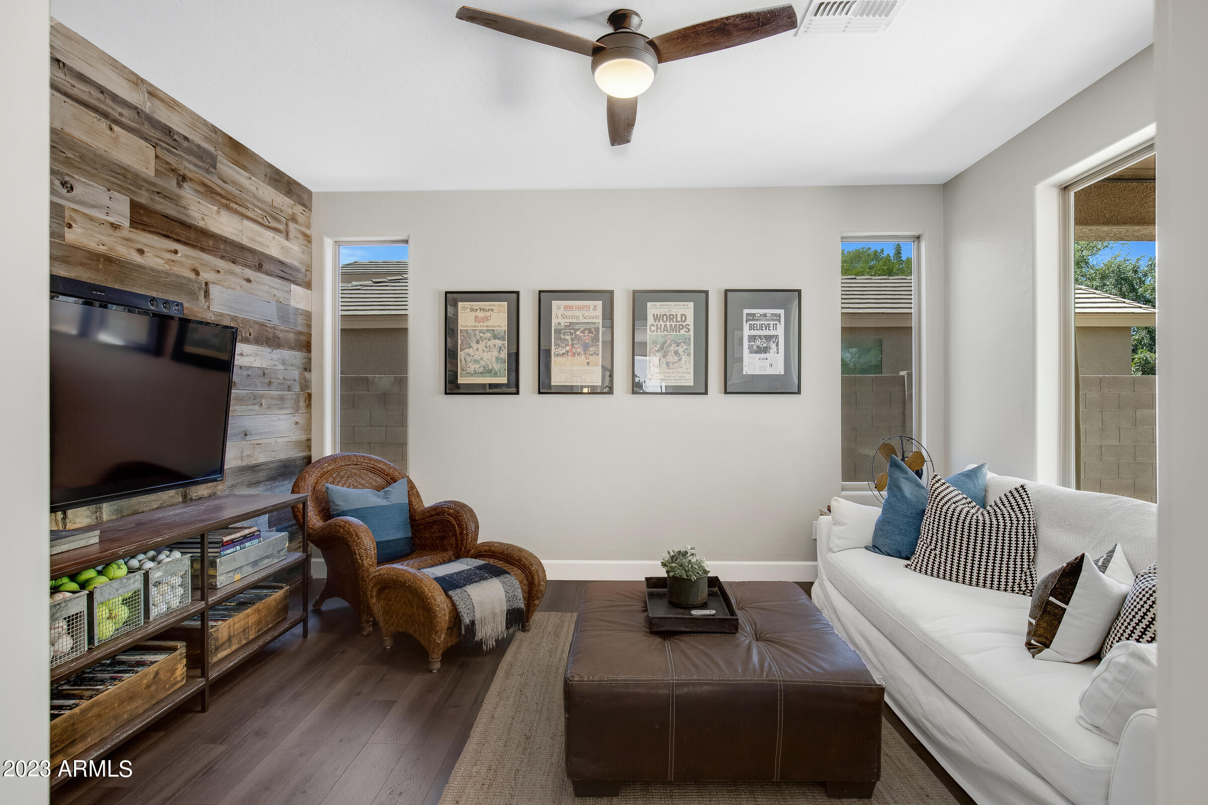 4736 East Timberline Road Gilbert, AZ 85297 - Photo 4 of 49 a living room with furniture and a flat screen tv