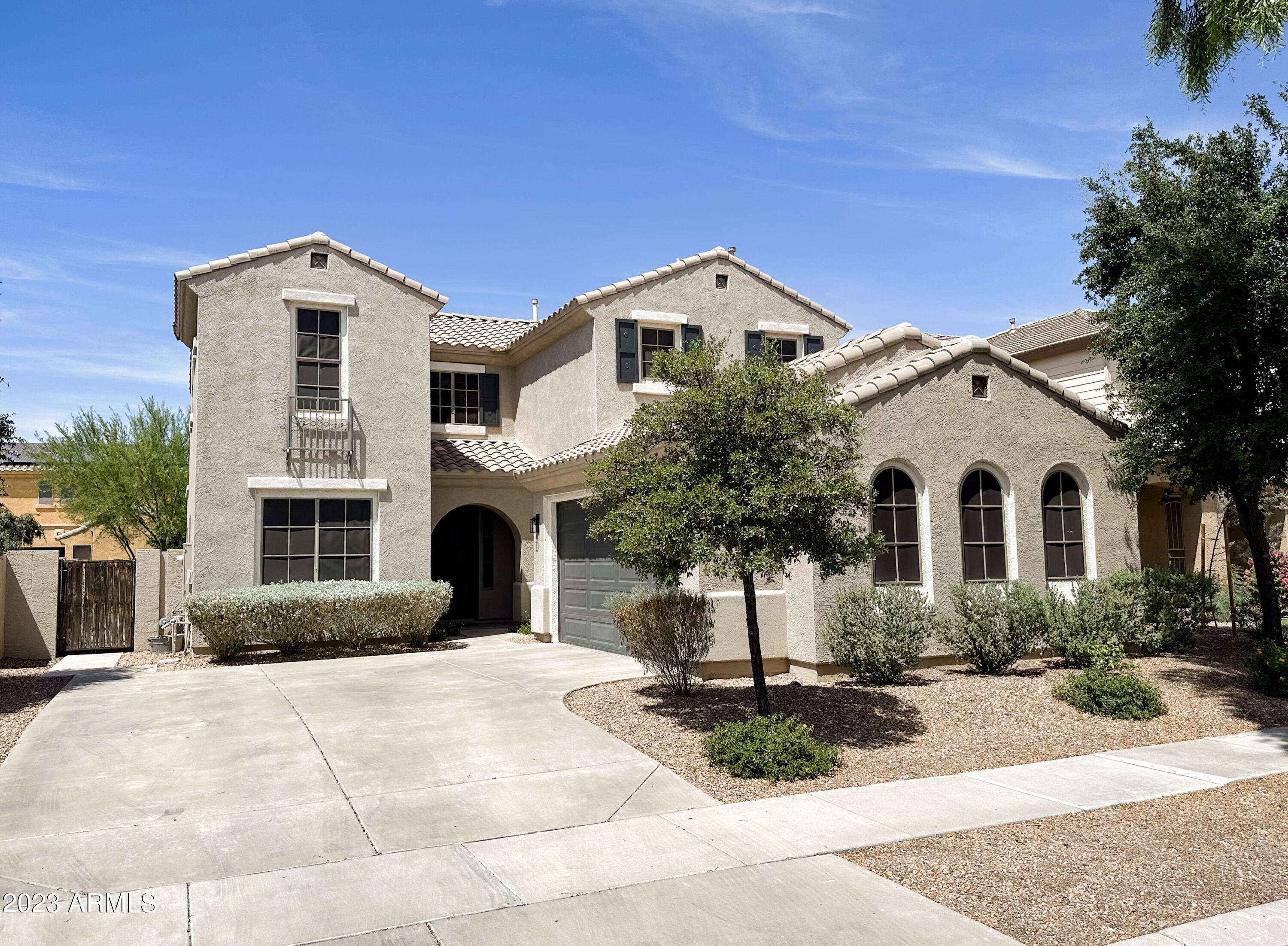 4736 East Timberline Road Gilbert, AZ 85297 - Photo 48 of 49 a front view of a house with garden