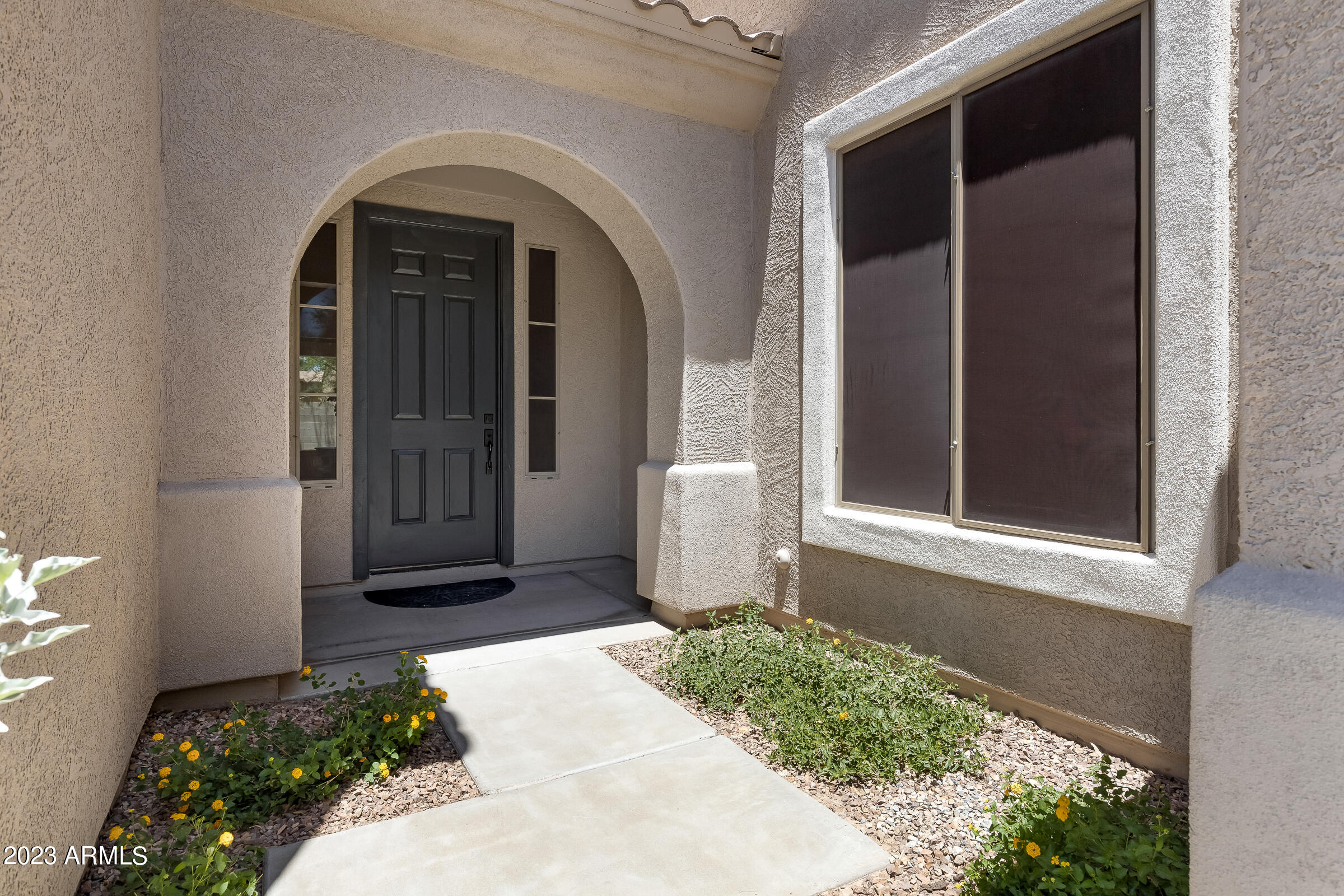 4736 East Timberline Road Gilbert, AZ 85297 - Photo 49 of 49 a front view of a house with a yard