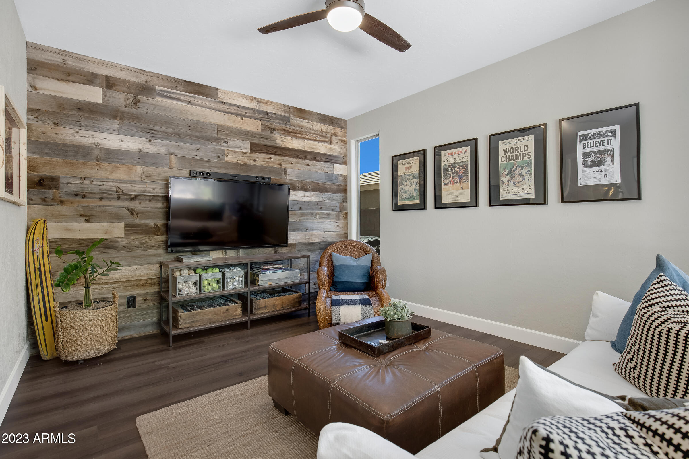 4736 East Timberline Road Gilbert, AZ 85297 - Photo 5 of 49 a living room with furniture and a flat screen tv