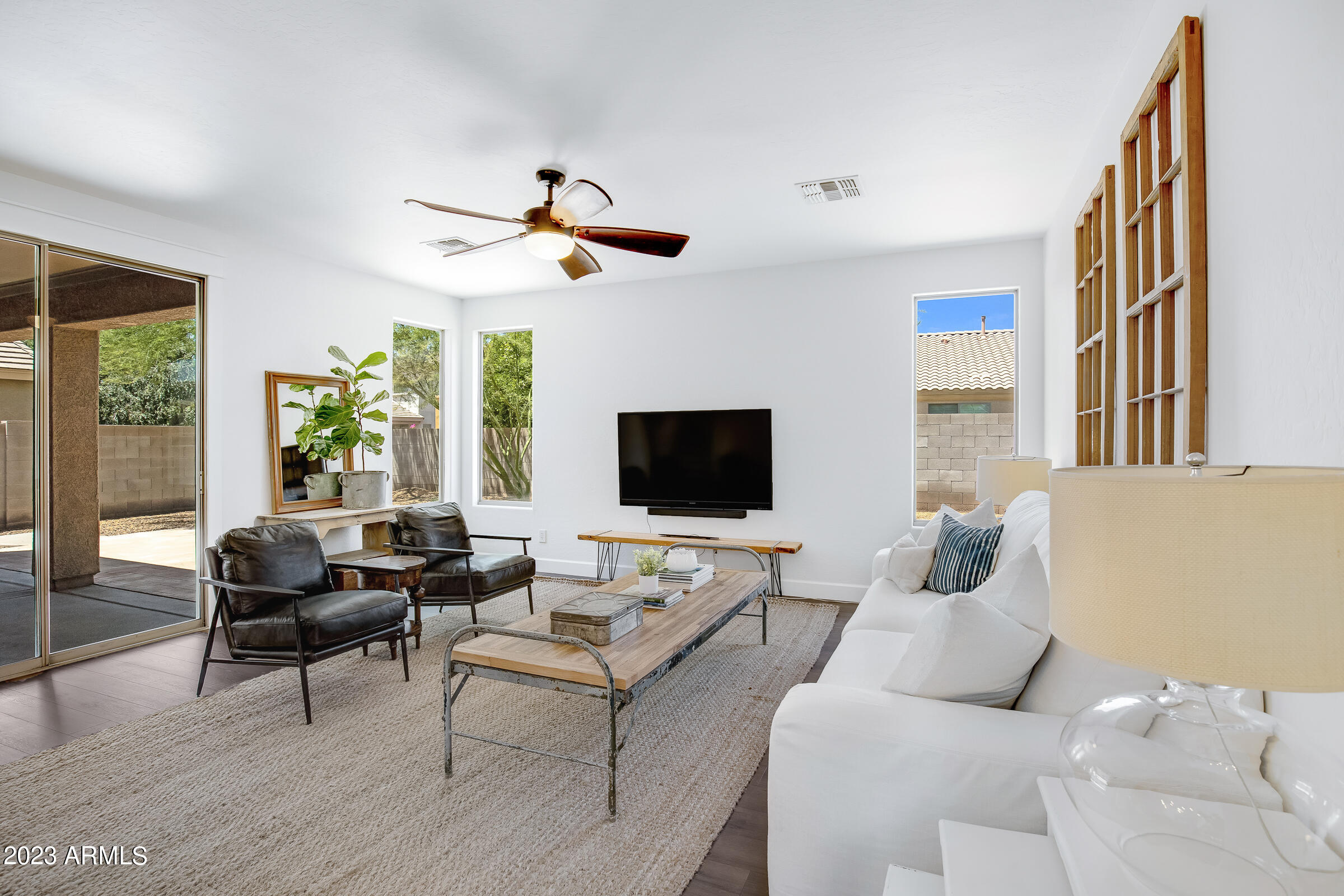 4736 East Timberline Road Gilbert, AZ 85297 - Photo 10 of 49 a living room with furniture and a flat screen tv