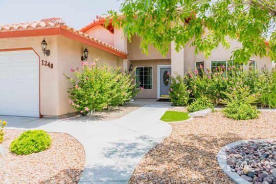 1248 Arroyo Street Ridgecrest, CA 93555 - Photo 3 of 34 a front view of a house with garden
