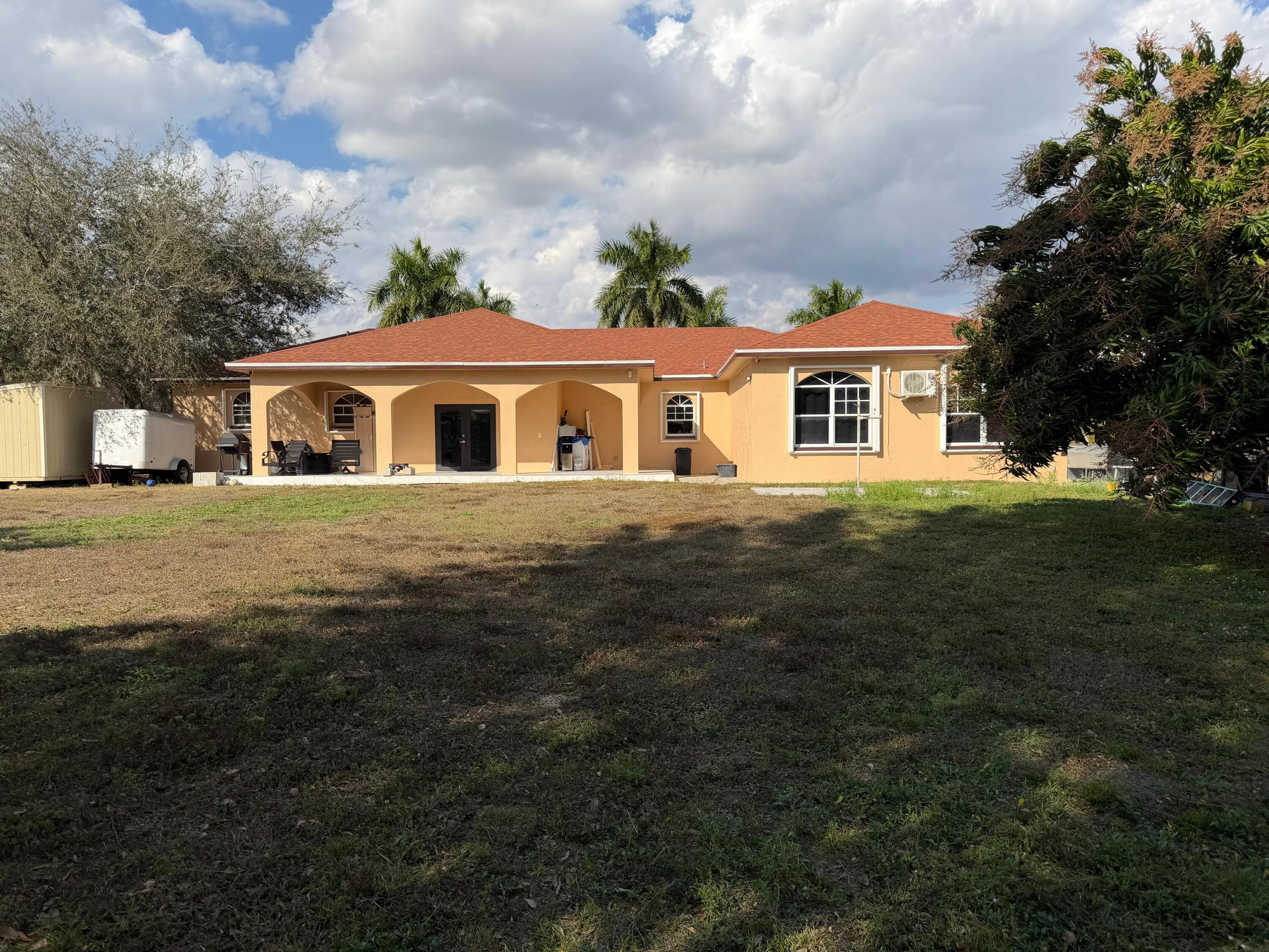435 East A Road East LaBelle, FL 33935 - Photo 1 of 35 a front view of a house with a garden