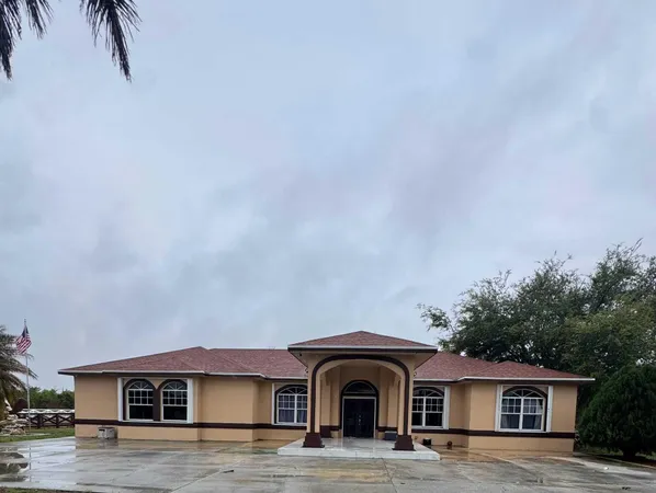 a front view of a house with yard