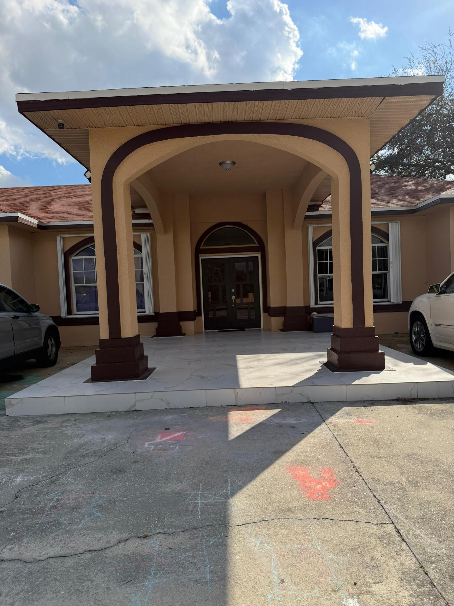 435 East A Road East LaBelle, FL 33935 - Photo 2 of 35 a front view of a house with parking
