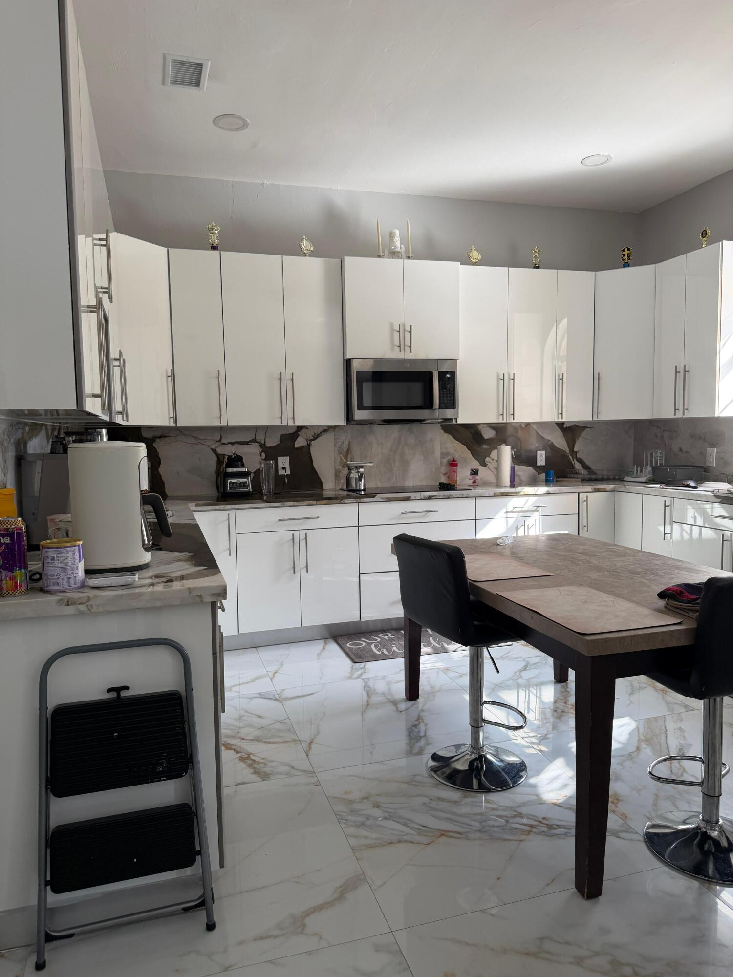 435 East A Road East LaBelle, FL 33935 - Photo 22 of 35 a kitchen with a sink cabinets and window