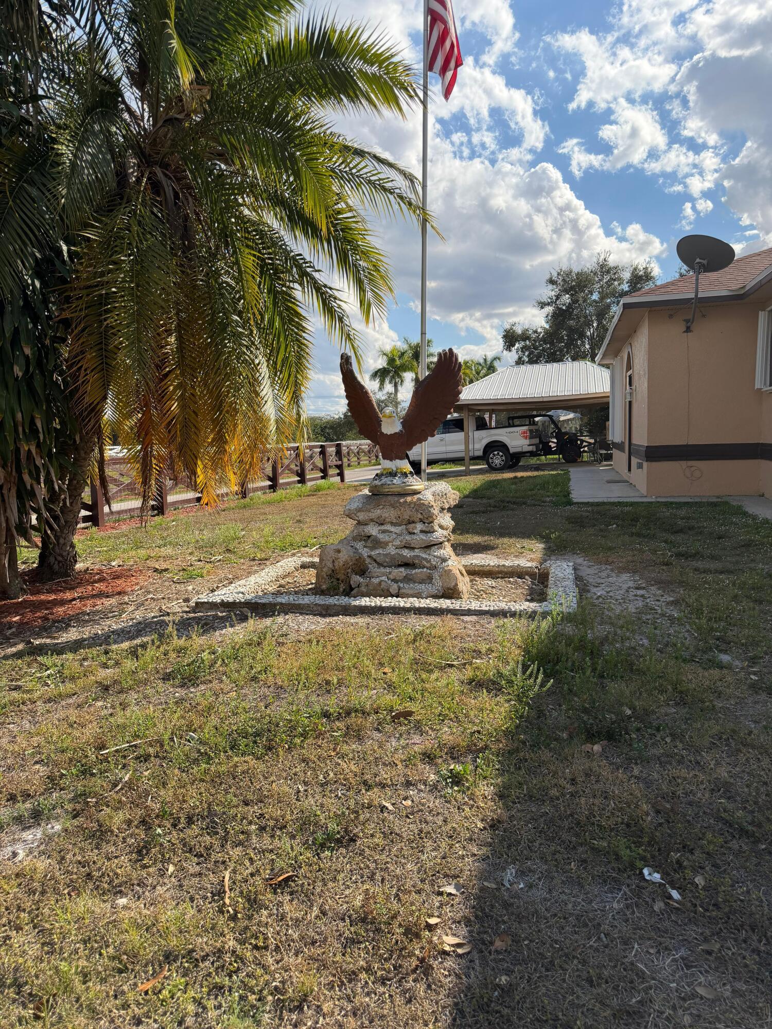 435 East A Road East LaBelle, FL 33935 - Photo 8 of 35 a view of a garden with a bench