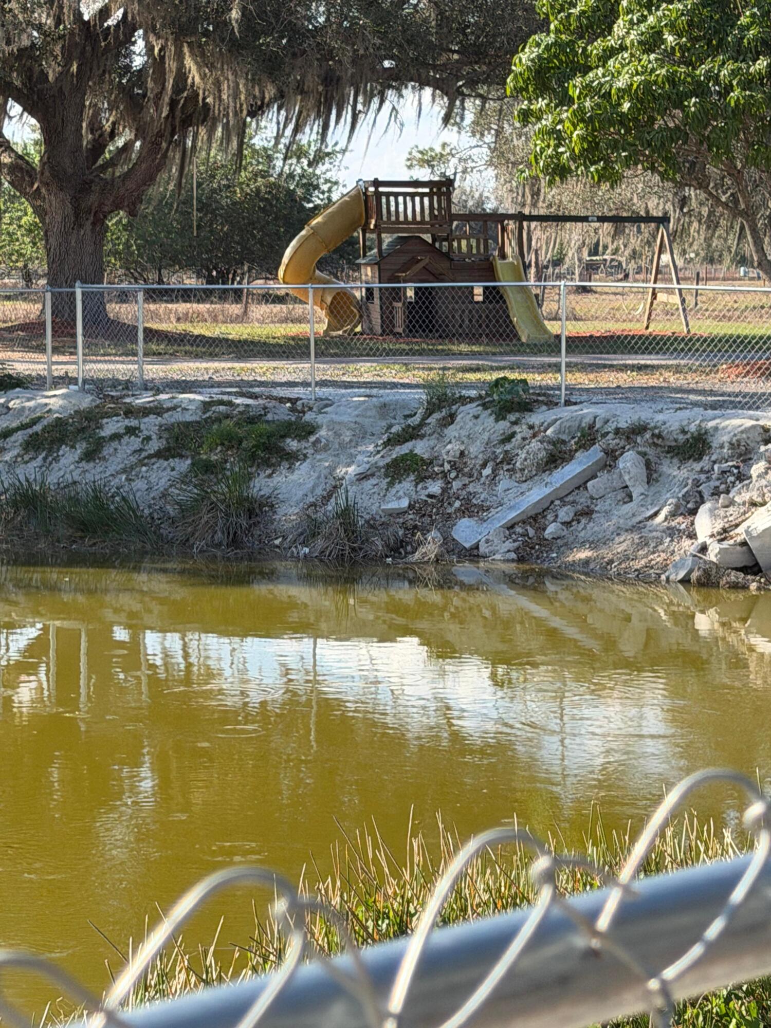 435 East A Road East LaBelle, FL 33935 - Photo 10 of 35 a view of a swimming pool with a patio and a yard
