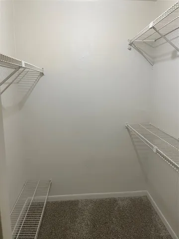 a view of a room with racks on the wall