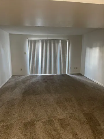 a view of empty room with windows