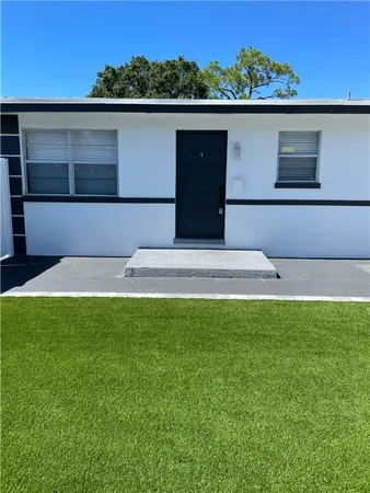 a view of swimming pool with a yard