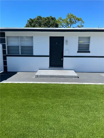 a view of swimming pool with a yard