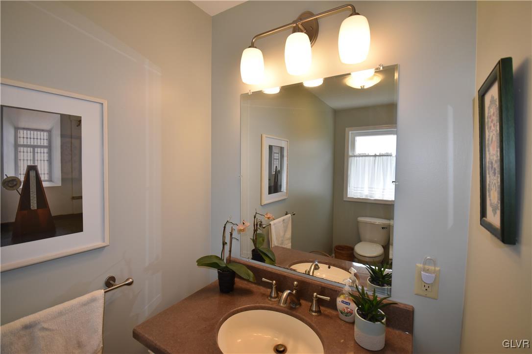 2996 Georgetown Road Nazareth, PA 18064 - Photo 33 of 36 a bathroom with a toilet a sink and mirror