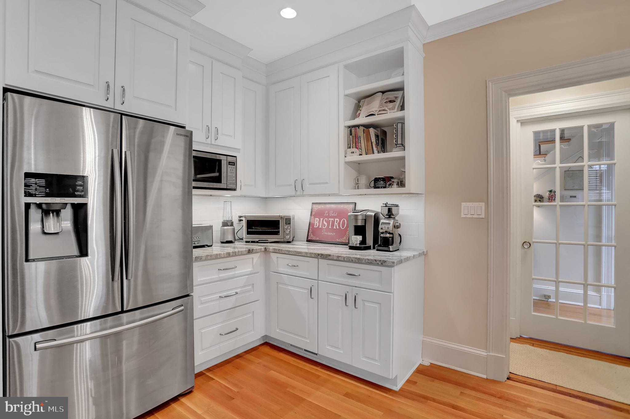 214 Northway Baltimore, MD 21218 - Photo 16 of 50 Kitchen with Fridge and Counter Work Area