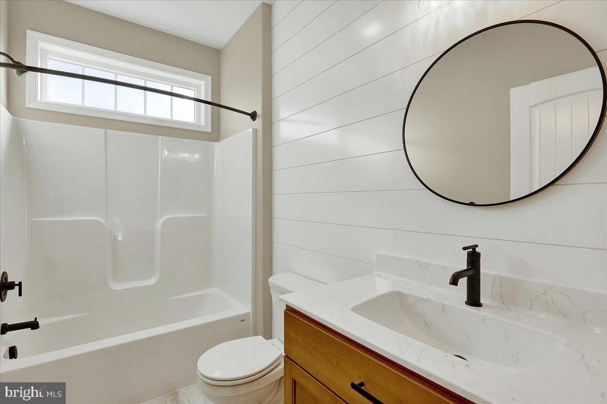 4 Rolling Meadow Road Lebanon, PA 17046 - Photo 17 of 37 a bathroom with a sink a toilet and a mirror