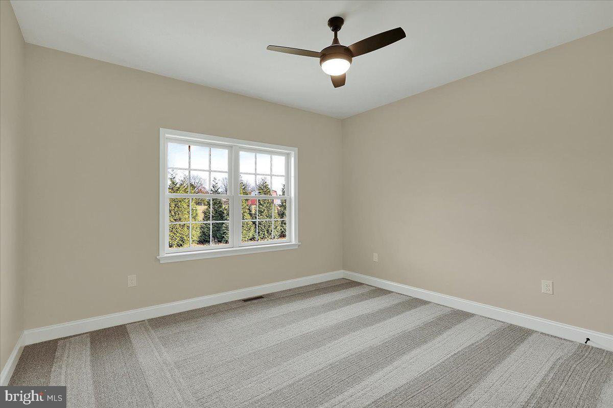 4 Rolling Meadow Road Lebanon, PA 17046 - Photo 19 of 37 an empty room with a window and a fan