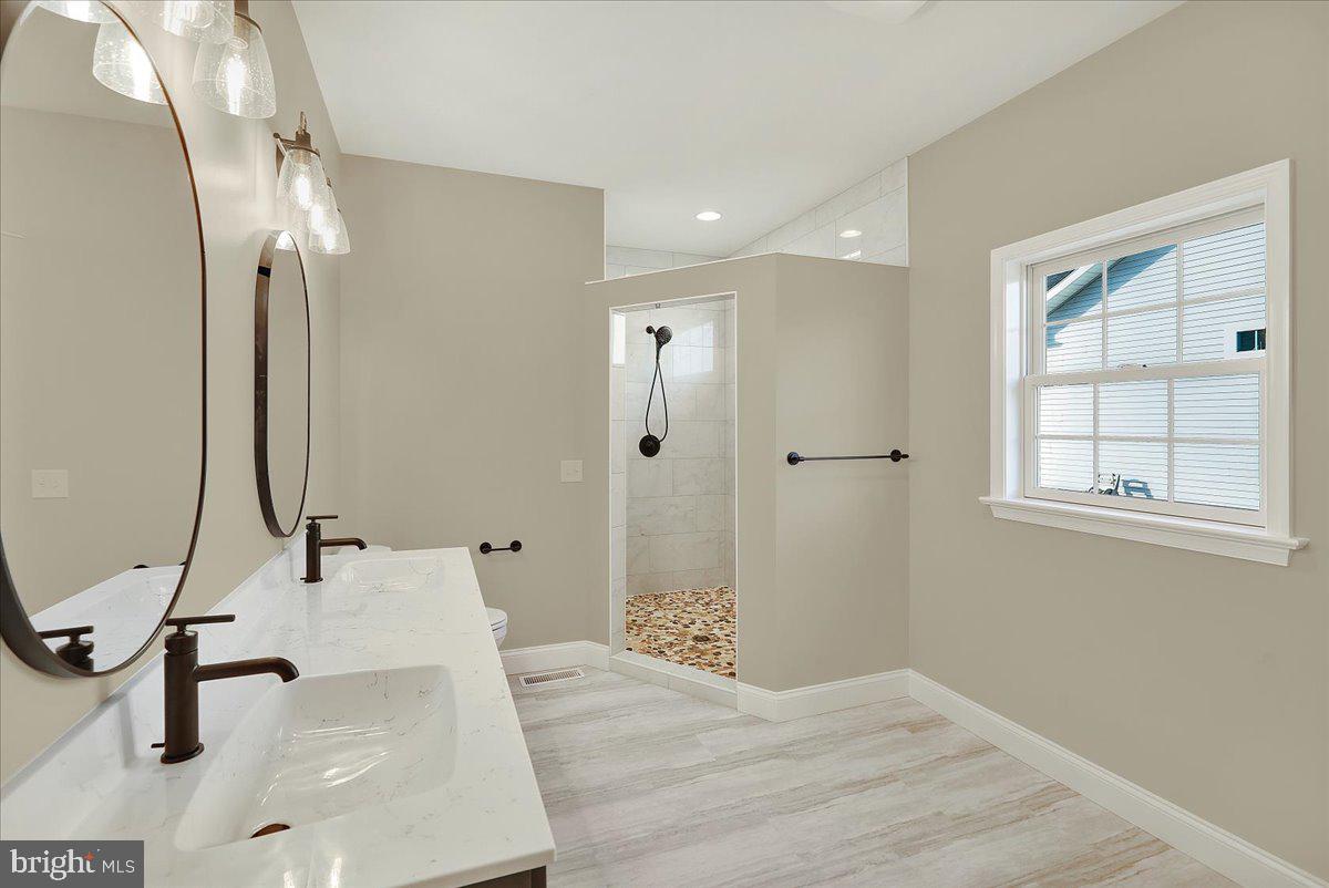 4 Rolling Meadow Road Lebanon, PA 17046 - Photo 23 of 37 a bathroom with a sink and a mirror