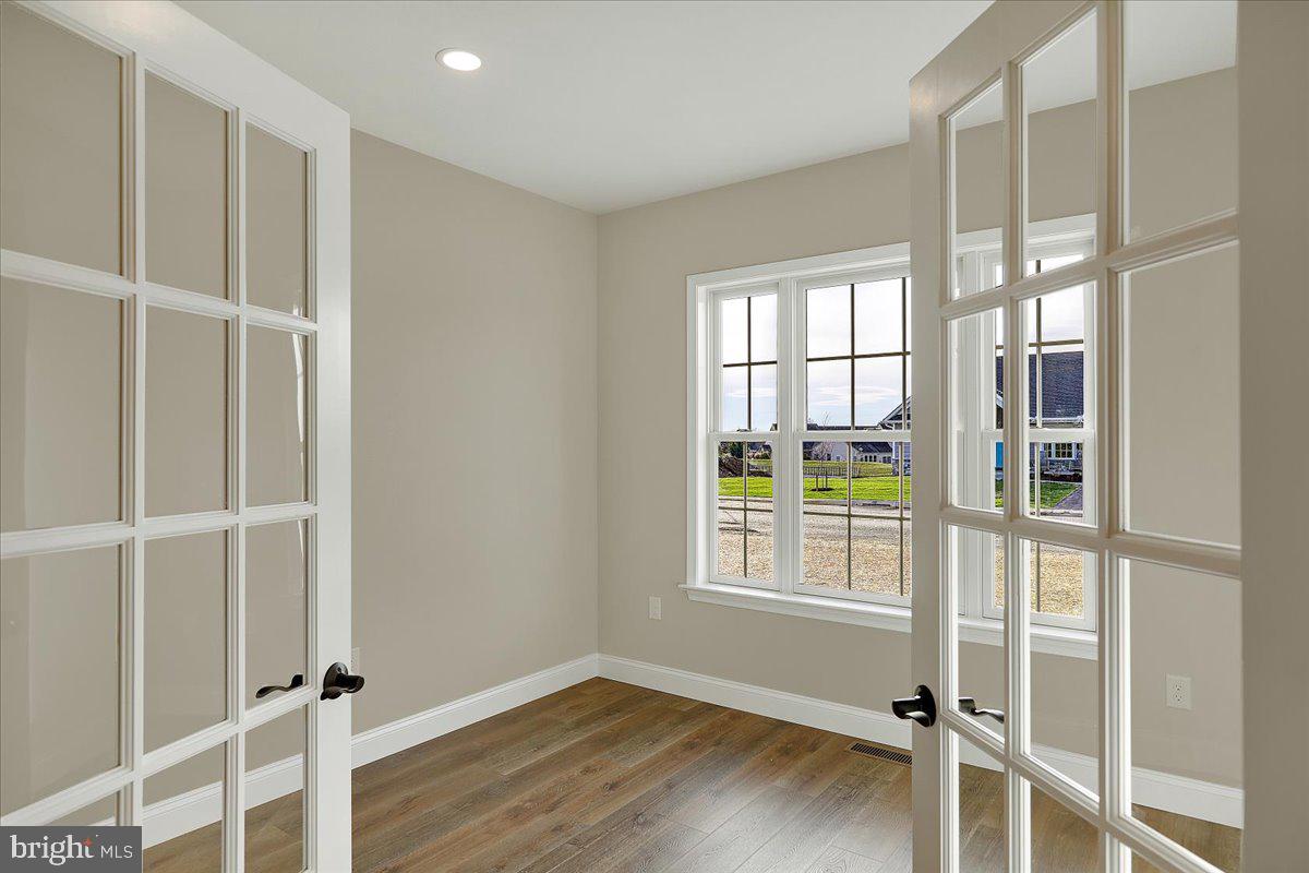 4 Rolling Meadow Road Lebanon, PA 17046 - Photo 32 of 37 an empty room with wooden floor and windows