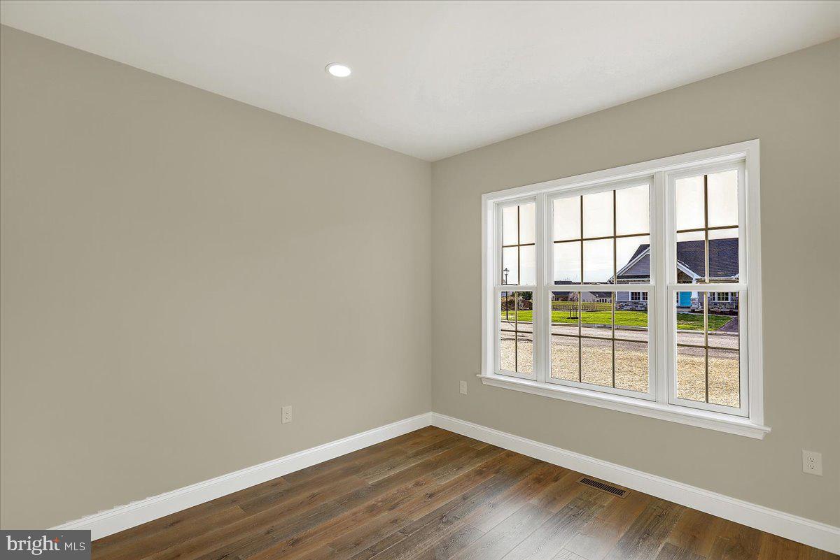 4 Rolling Meadow Road Lebanon, PA 17046 - Photo 33 of 37 an empty room with wooden floor and windows