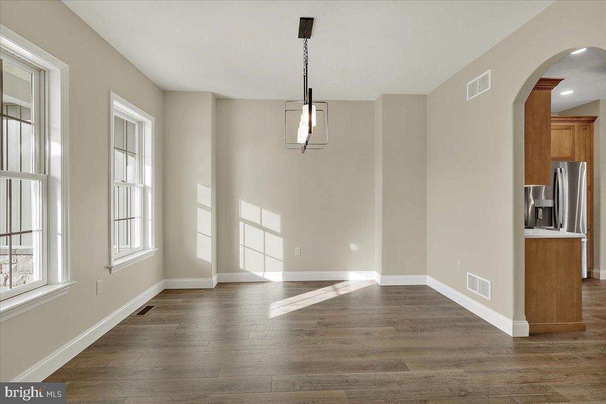 4 Rolling Meadow Road Lebanon, PA 17046 - Photo 7 of 37 an empty room with wooden floor and windows