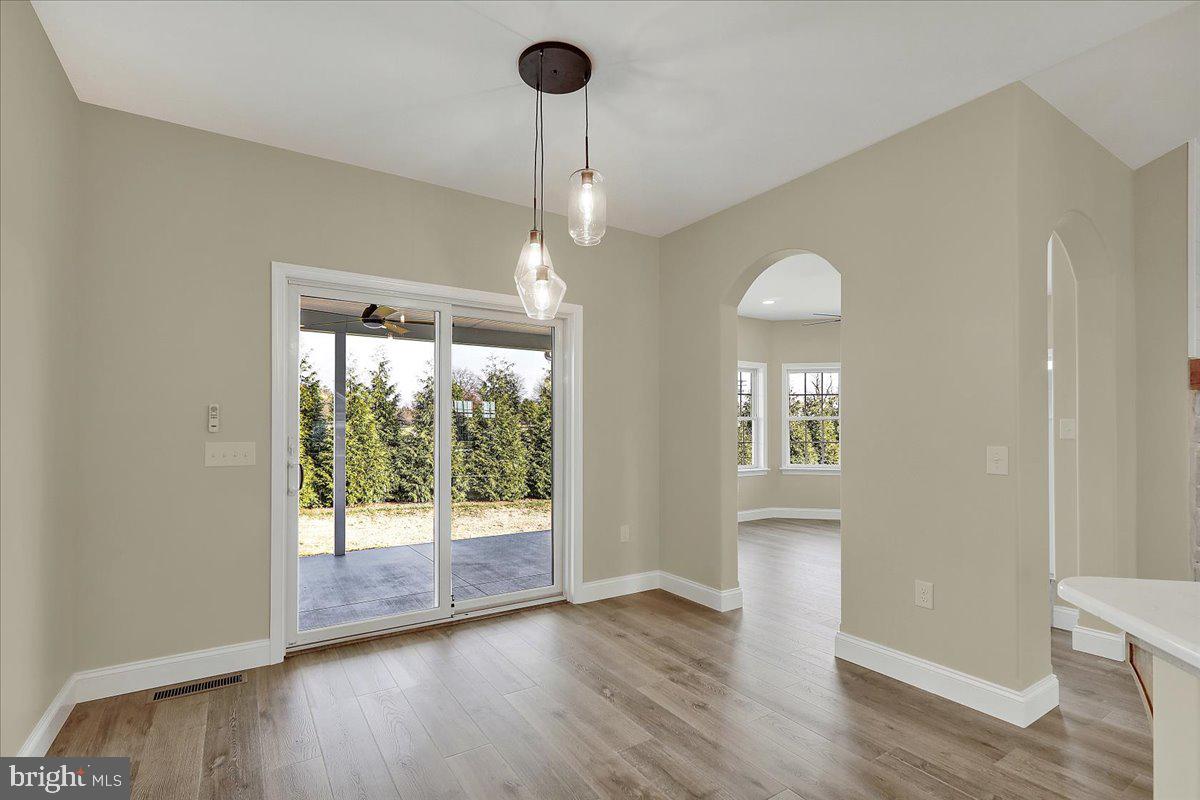 4 Rolling Meadow Road Lebanon, PA 17046 - Photo 9 of 37 a view of a room with wooden floor fireplace and outdoor view