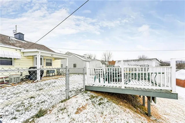 a bedroom with a bed and a night stand