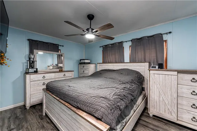 a bed room with a bed and a television