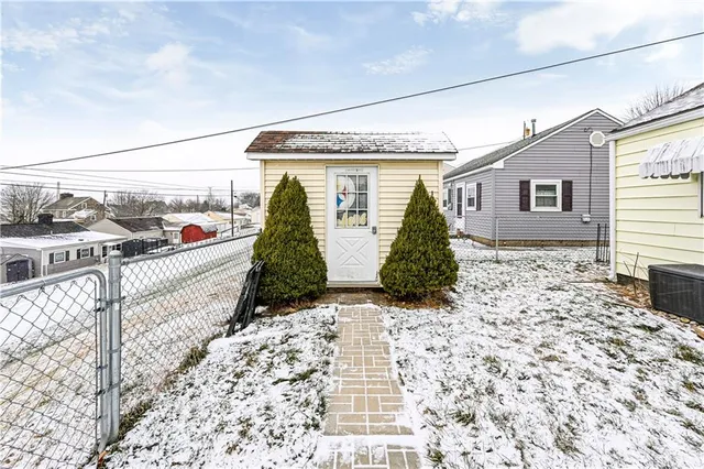 a view of a chair and table in the patio