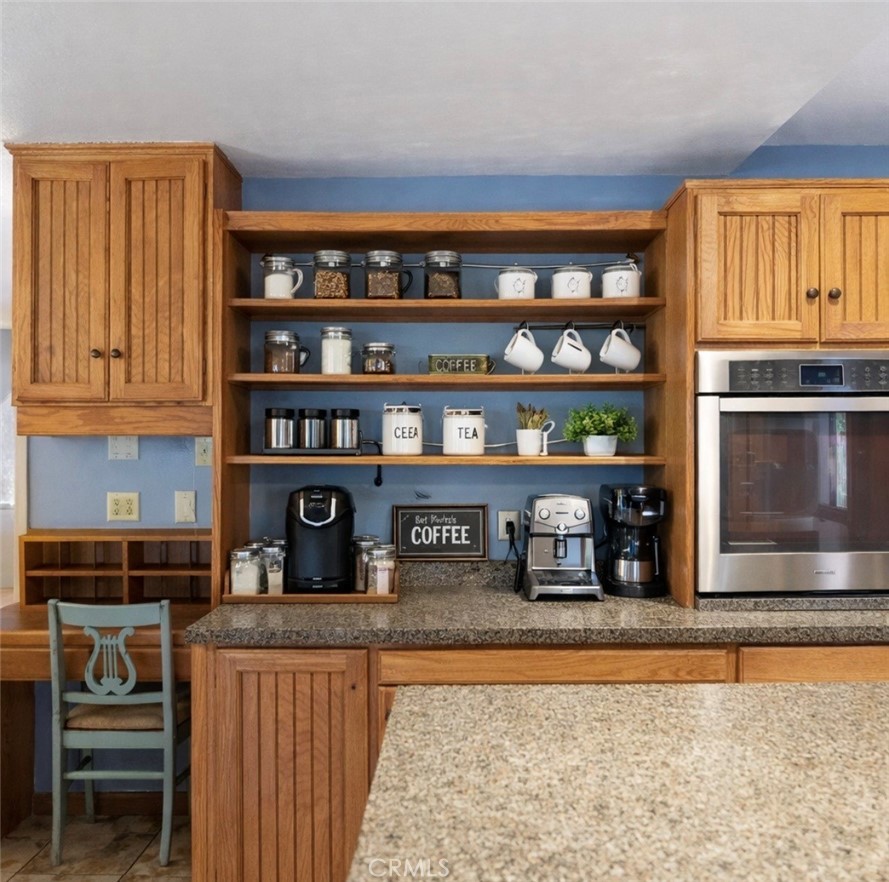 21645 Jobs Peak Road Cedarpines Park, CA 92322 - Photo 15 of 72 Shelf area kitchen staged by AI