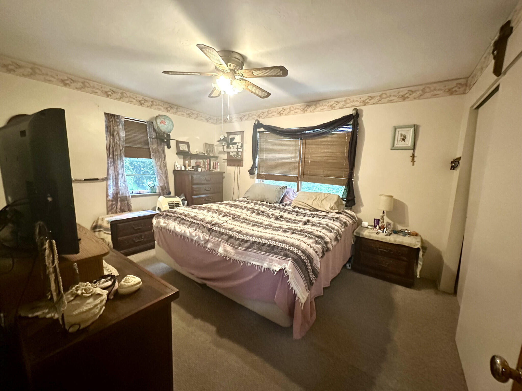 22 Stirrup Key Road Marathon, FL 33050 - Photo 7 of 15 a bedroom with a bed and a chandelier