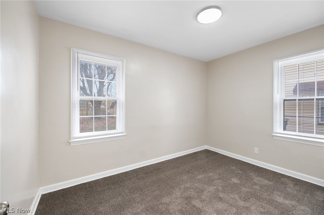 878 Reed Avenue Akron, OH 44306 - Photo 12 of 29 Unfurnished room featuring dark colored carpet