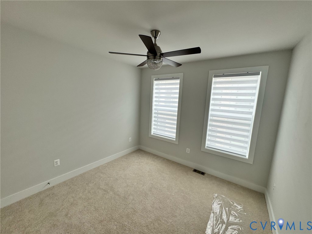 1512 West Moore Street, Unit B Richmond, VA 23220 - Photo 13 of 34 Carpeted spare room featuring baseboards and ceili