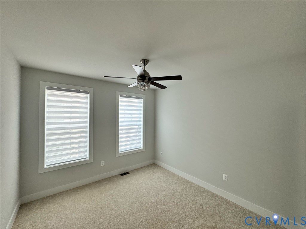 1512 West Moore Street, Unit B Richmond, VA 23220 - Photo 15 of 34 Carpeted spare room with baseboards and ceiling fa