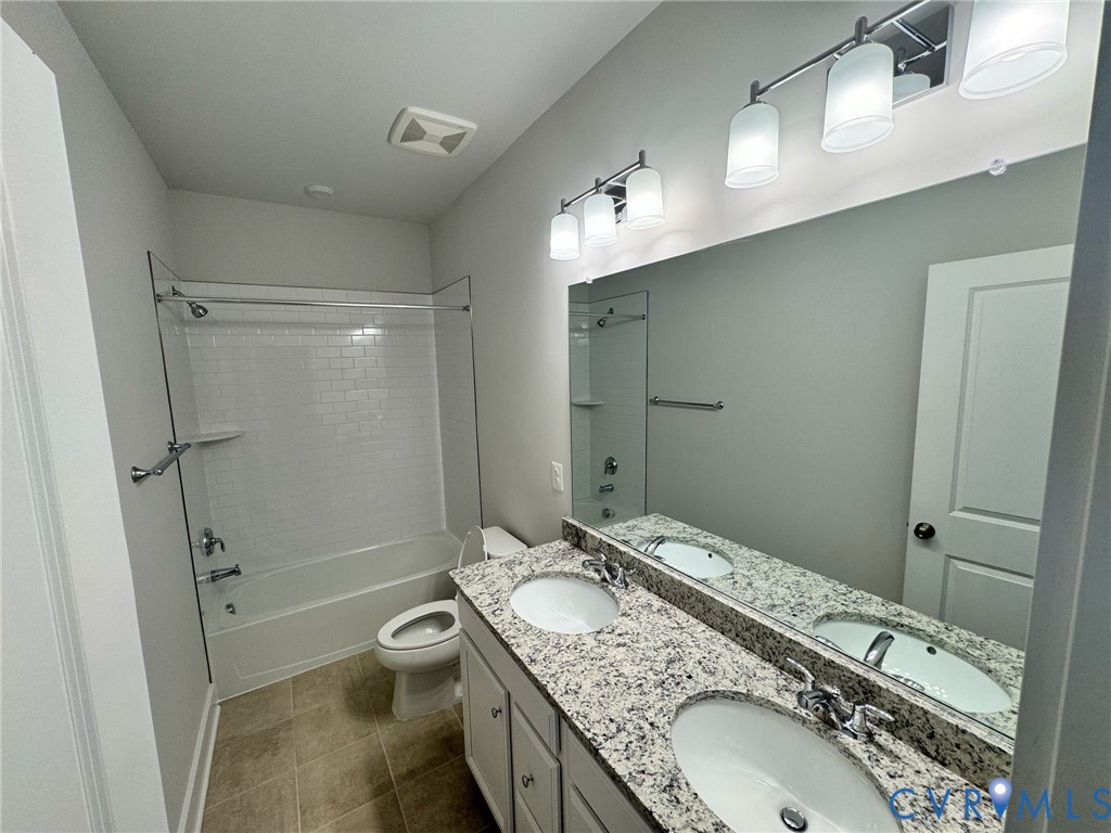 1512 West Moore Street, Unit B Richmond, VA 23220 - Photo 16 of 34 Bathroom featuring shower combination, double van