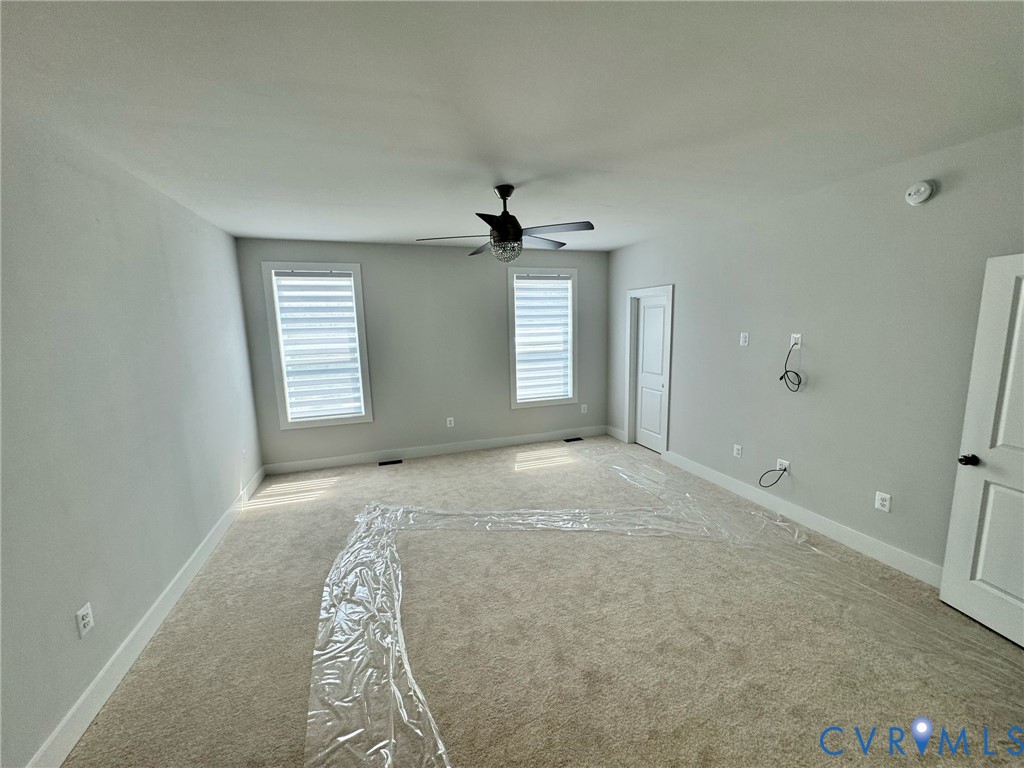 1512 West Moore Street, Unit B Richmond, VA 23220 - Photo 18 of 34 Carpeted empty room featuring baseboards and ceili