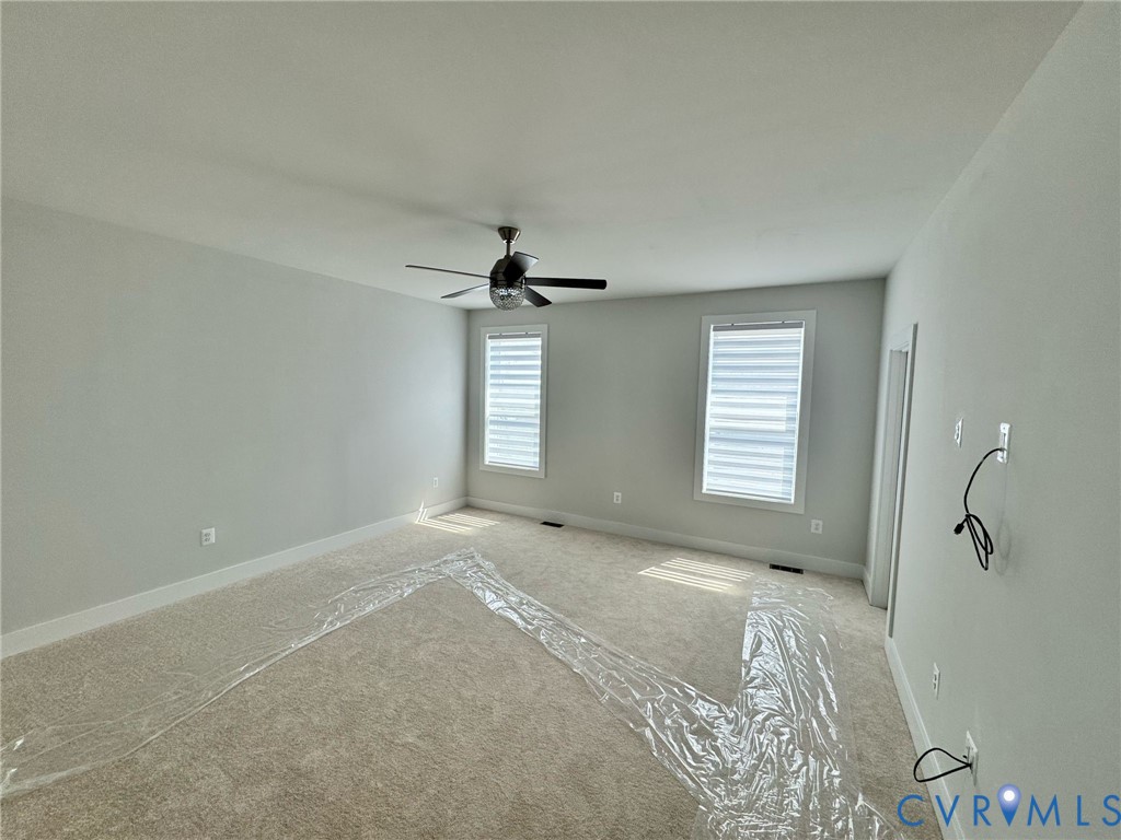 1512 West Moore Street, Unit B Richmond, VA 23220 - Photo 21 of 34 Carpeted spare room featuring baseboards and ceili