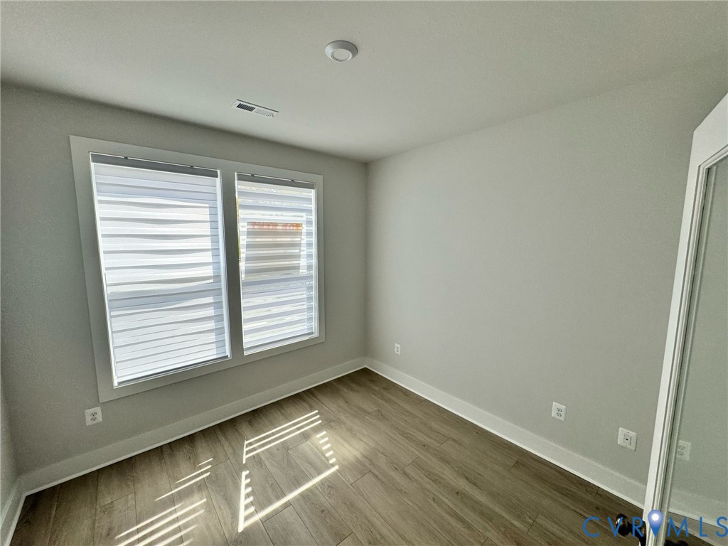 1512 West Moore Street, Unit B Richmond, VA 23220 - Photo 22 of 34 Spare room with wood finished floors and baseboard
