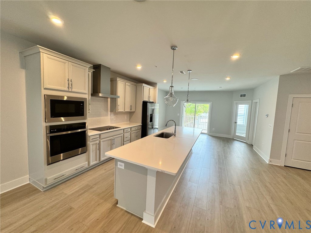 1512 West Moore Street, Unit B Richmond, VA 23220 - Photo 24 of 34 Kitchen with appliances with stainless steel finis