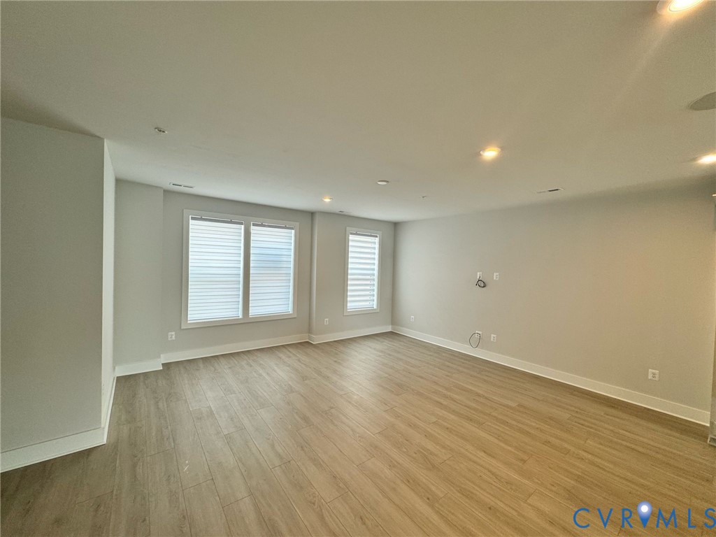 1512 West Moore Street, Unit B Richmond, VA 23220 - Photo 26 of 34 Empty room featuring light wood finished floors an